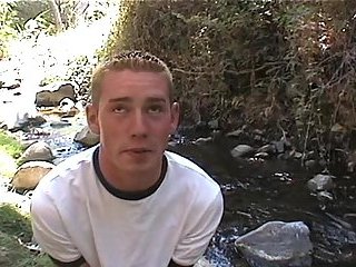 Forest twink masturbates near the stream