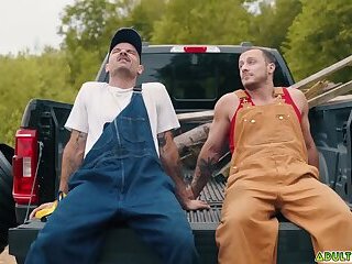 Two sweaty farmhands Zack Mackay and Tito Patron taking a load off outdoor