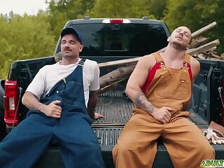 Two sweaty farmhands Zack Mackay and Tito Patron taking a load off outdoor